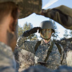 Female,Solider,Saluting,Troop,During,Training,Session